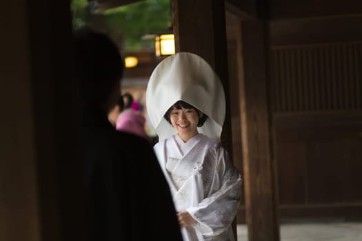 TOKYO, JAPAN - NOVEMBER 11: Wedding Ceremony in Tokyo, Japan on November 11, 2016. Photo of young groom and bride during japanese traditional wedding ceremony at Meiji-jingu shrine.
