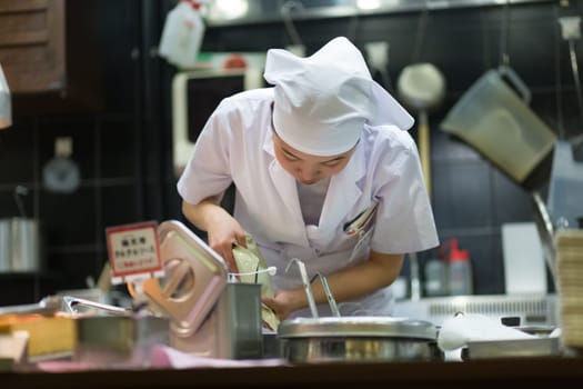 KYOTO, JAPAN - NOVEMBER 11: Ramen restaurant in Kyoto, Japan on November 11, 2016. Unidentified Japanese Ramen chefs prepare a bowl of traditional home made ramen noodle for customers.
