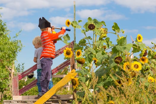 BERLIN, GERMANY- Sep 28, 2016: Kids playing pirates in urban gardens at Tempelhofer field, once airport, now a public park in Berlin, Germany, on 28th of september, 2016.