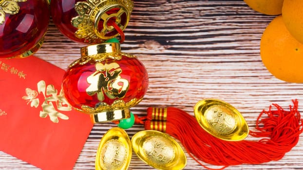 Kuala Lumpur, Malaysia- September 12, 2017:  Mandarin Orange, Red Envelopes, lantern land Gold Ingots. New Year background concept