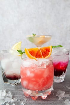 Variety of colorful cocktails and longdrinks on ice