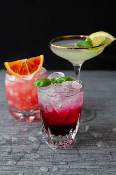 Variety of colorful cocktails and longdrinks on ice