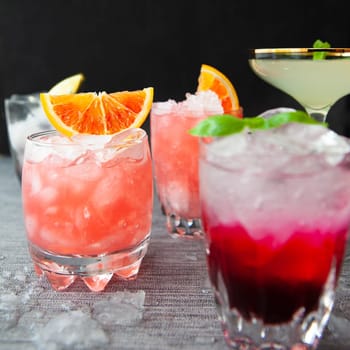 Variety of colorful cocktails and longdrinks on ice