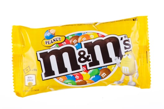 M&M’s peanut candies isolated on white background. M&M's are produced by Mars Incorporated, USA. M&M’s peanut candies were introduced on market in 1954