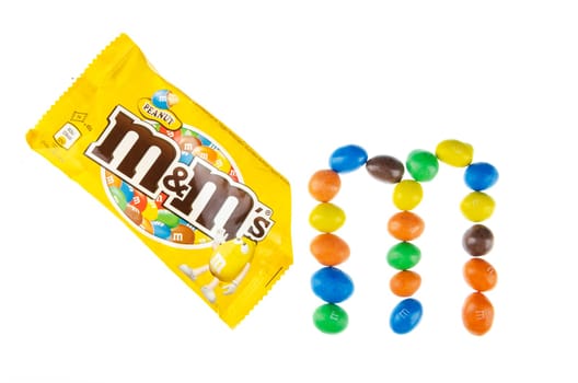 M&M’s peanut candies isolated on white background. M&M's are produced by Mars Incorporated, USA. M&M’s peanut candies were introduced on market in 1954