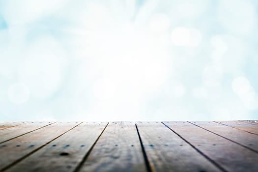 Sunny blue sky over wooden deck background