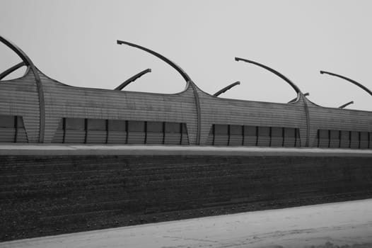 Architecture lines under the bridge. Speedway black and white
