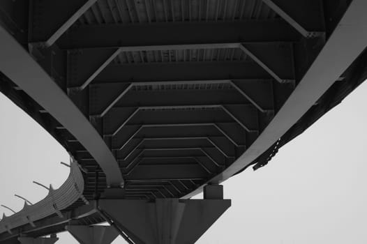 Architecture lines under the bridge. Speedway black and white
