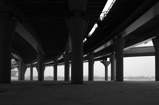 Architecture lines under the bridge. Speedway black and white