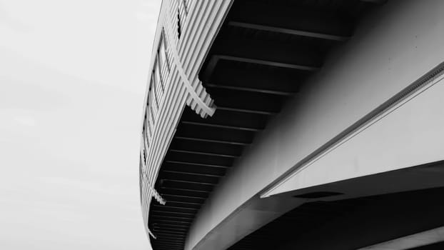 Architecture lines under the bridge. Speedway black and white