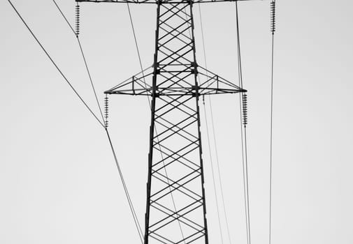 High voltage tower. Power line black and white background