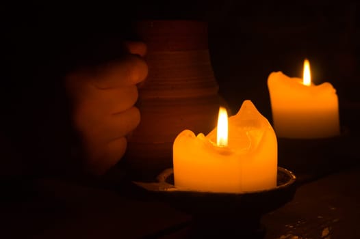 Burning candle in the dark