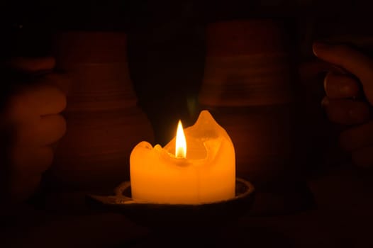 Burning candle in the dark