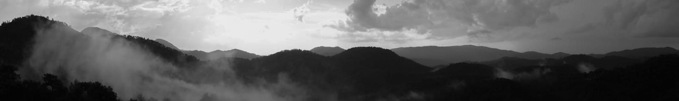 Mountain panorama. landscape with the dramatic sky view. black and white background