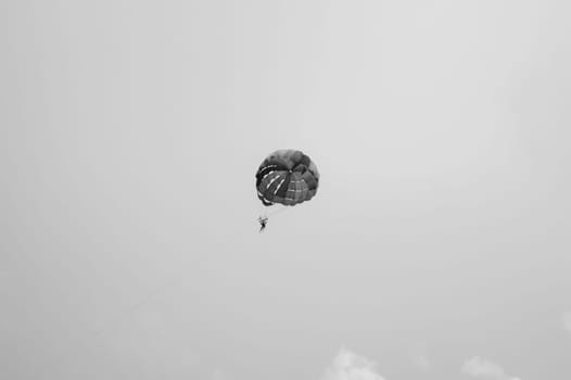 Skydiver flying with a parachute