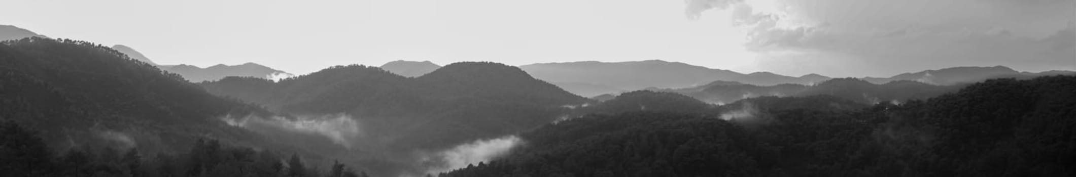 Mountain panorama. landscape with the dramatic sky view. black and white background