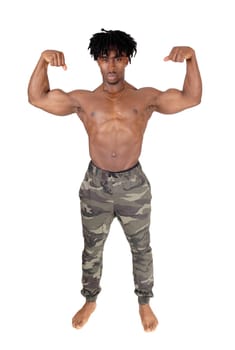 A full body image of an African American man in camoflash pants and.shirtless flexing his biceps, isolated for white background.