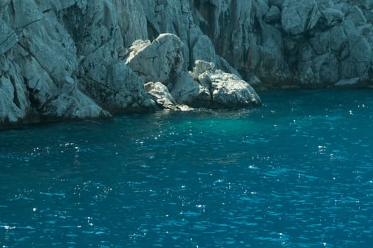 Mountain and sea. coastline with a rock