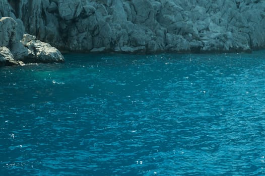 Mountain and sea. coastline with a rock