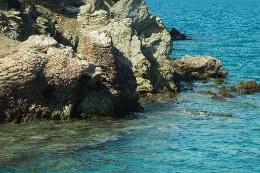 Mountain and sea. coastline with a rock