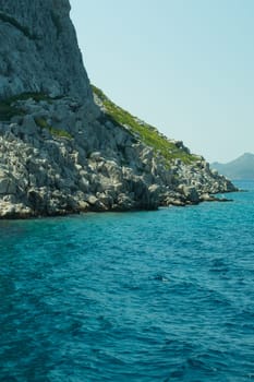Mountain and sea. coastline with a rock