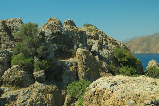 Mountain and sea. rocky cliff background