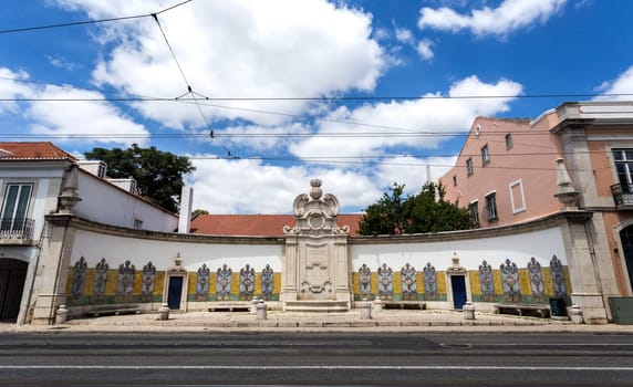 Portuguese architecture showing the Chafariz da Cordoaria, also know as Chafariz da Junqueira, built in early 19th century with lioz stone and traditional decorative tile panels, in Lisbon, Portugal.Transl: Free Water  Year 1821.