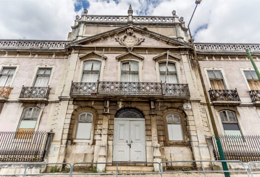 Monumental facade of the derelict Palace of Condes da Ribeira Grande, built in the early years of the 18th century in Alcantara, Lisbon, Portugal