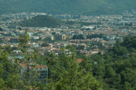 Mountain town panoramic view. landscape with a city between the hills