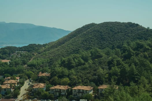 Mountain town panoramic view. landscape with a city between the hills