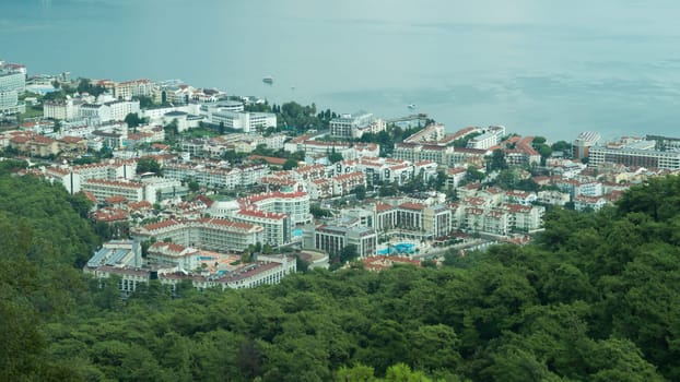 Nature landscape with a city by the shore of the sea between the hills. mountain town panoramic view