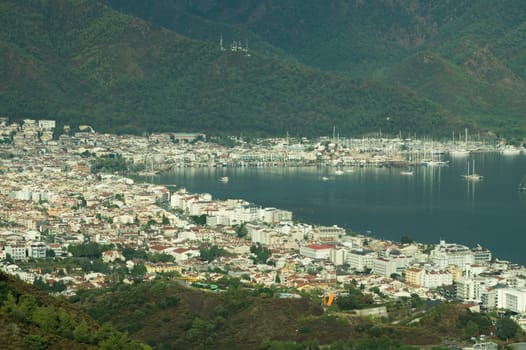 Nature landscape with a city by the shore of the sea between the hills. mountain town panoramic view
