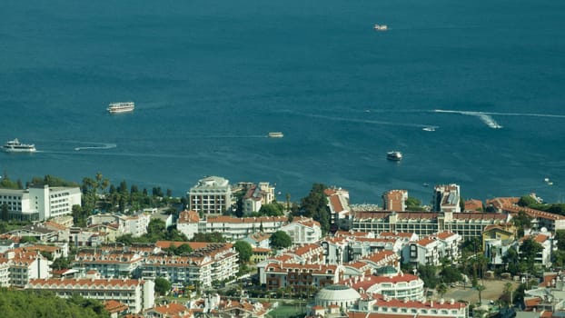 Nature landscape with a city by the shore of the sea between the hills. mountain town panoramic view