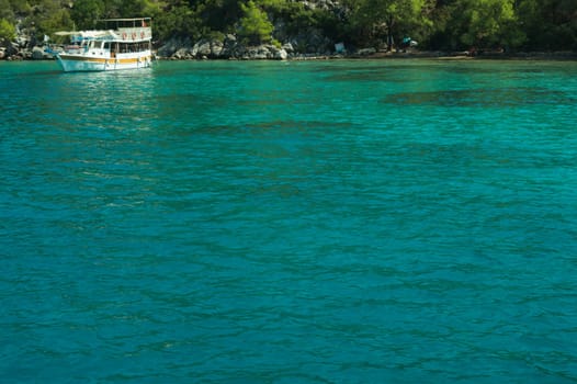 Recreation on the boat near the shore of a mountain