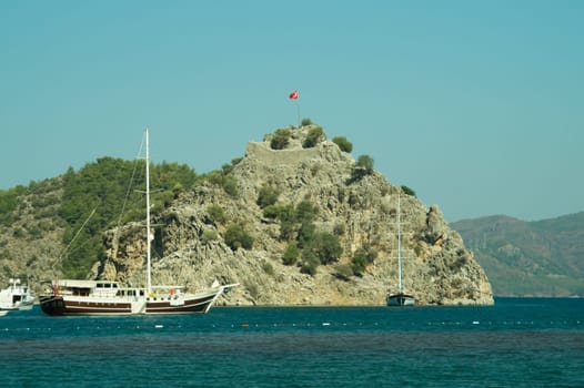 Recreation on the boat near the shore of a mountain