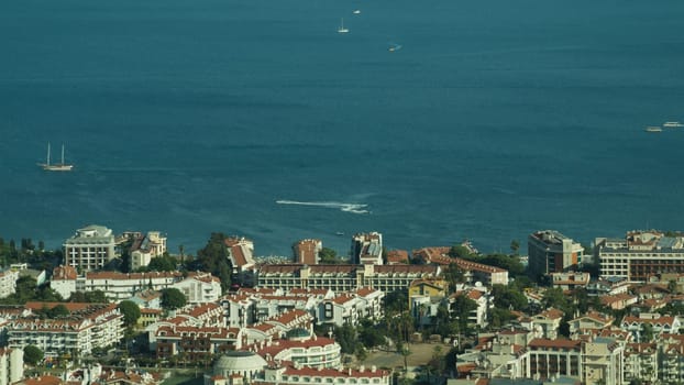 Nature landscape with a city by the shore of the sea between the hills. mountain town panoramic view