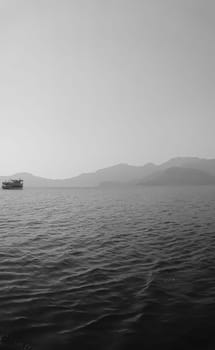 Recreation on the boat near the shore of a mountain