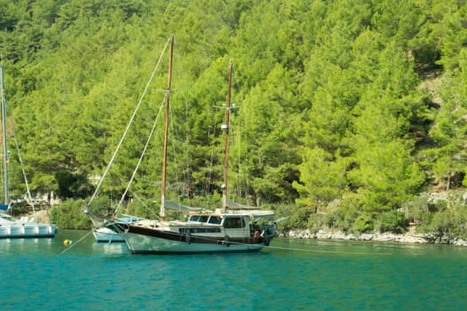 Recreation on the boat near the shore of a mountain