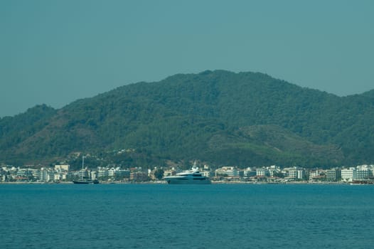 Recreation on the boat near the shore of a mountain