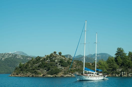 Recreation on the boat near the shore of a mountain