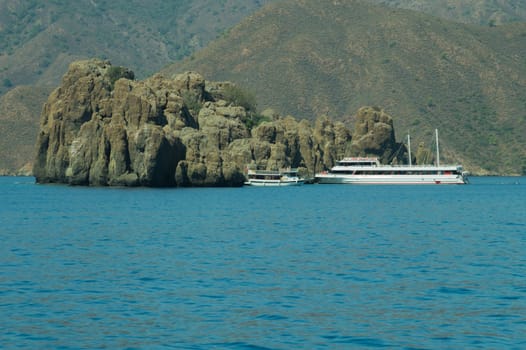 Recreation on the boat near the shore of a mountain
