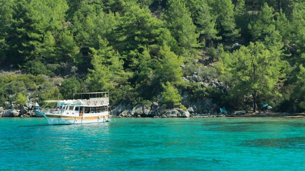 Recreation on the boat near the shore of a mountain