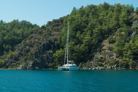 Recreation on the boat near the shore of a mountain