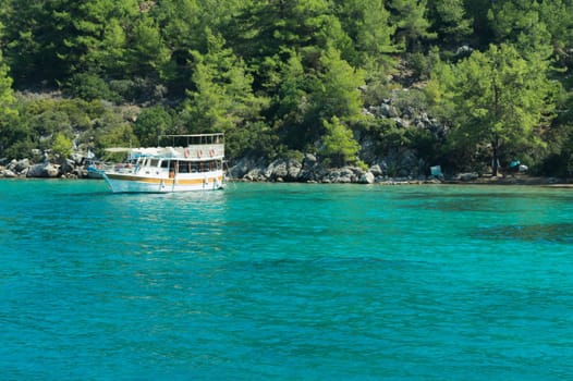 Recreation on the boat near the shore of a mountain