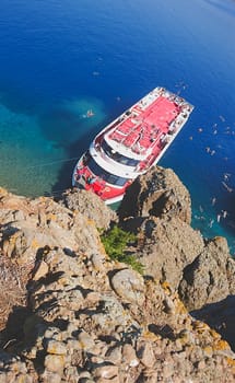 Recreation on the boat near the shore of a mountain