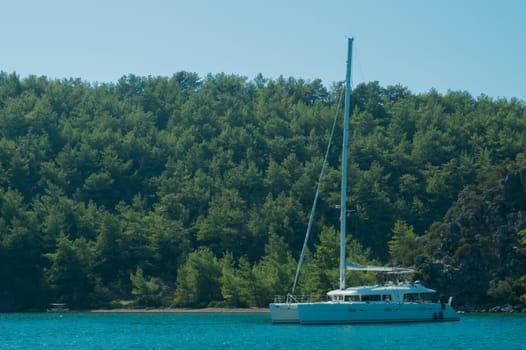Recreation on the boat near the shore of a mountain