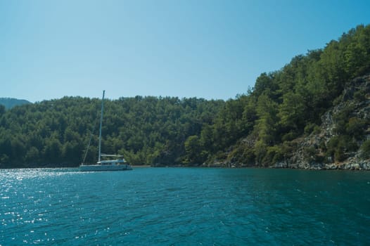 Recreation on the boat near the shore of a mountain