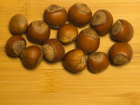 Hazelnuts on a wooden background