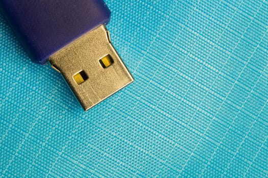 Memory stick isolated on blue background. usb flash drive macro. copy space