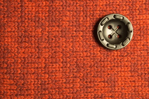 Button on textile background. copy space